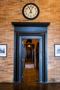 Clock on door of building