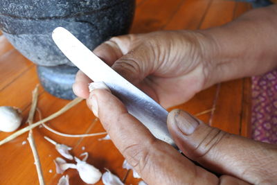 Close-up of woman hand holding cigarette