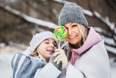 Portrait of smiling woman holding ice cream