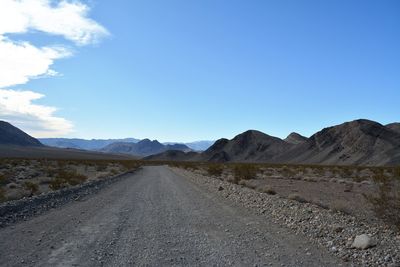 Road passing through a desert - race track playa death valley national park