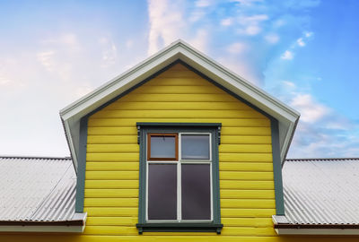 Roof window in velux style with roof tiles - icelandic architecture