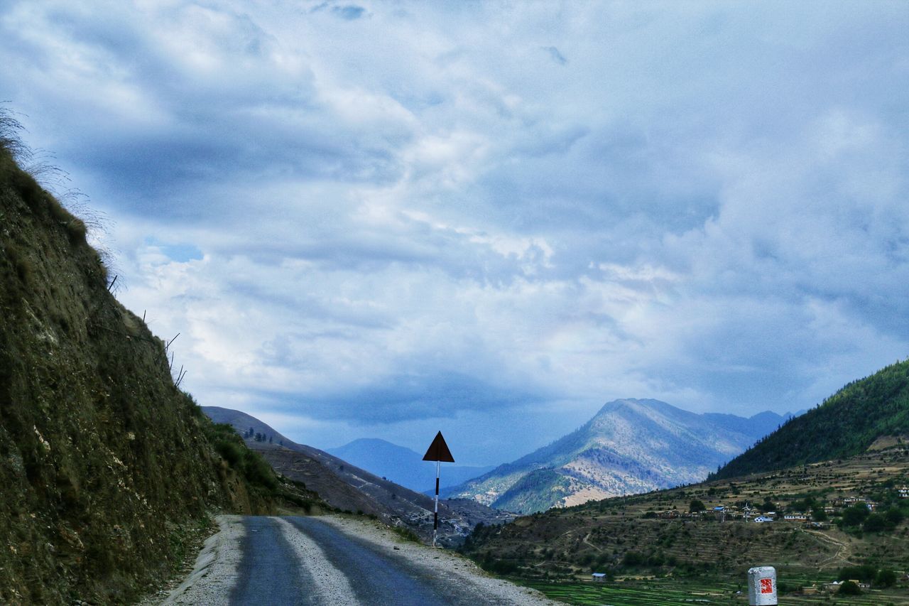 mountain, sky, transportation, road, mountain range, the way forward, landscape, cloud - sky, tranquility, tranquil scene, scenics, cloudy, nature, beauty in nature, country road, cloud, non-urban scene, remote, diminishing perspective, day