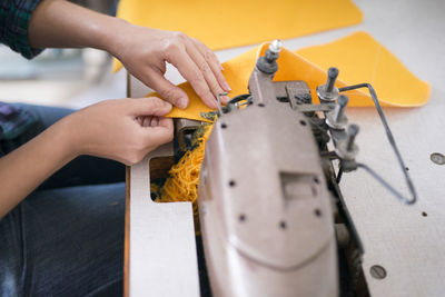 Tailor sewing in workshop