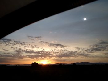 Scenic view of silhouette landscape against sky during sunset