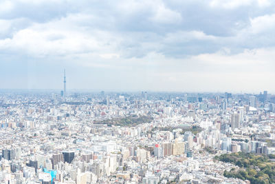 High angle view of city buildings against sky