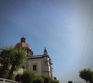 Low angle view of built structure against blue sky