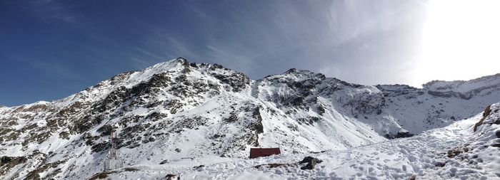 Low angle view of snowcapped mountain against sky