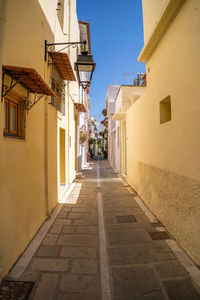 Narrow alley amidst buildings in town