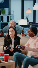 Colleagues playing game after work in office
