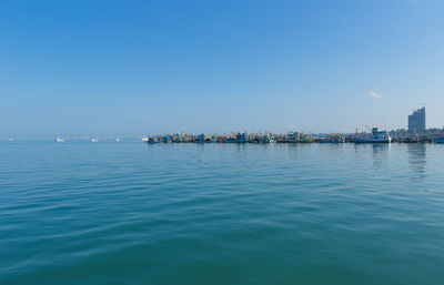 Scenic view of sea against clear blue sky