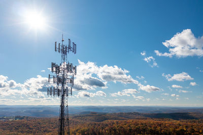 Low angle view of communications tower against sky