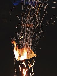 Close-up of fireworks against sky at night