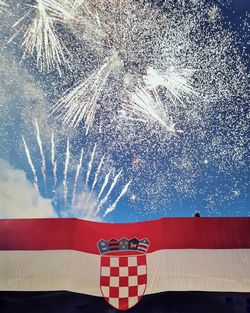Low angle view of flag against sky