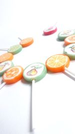 Close-up of multi colored pencils on white background