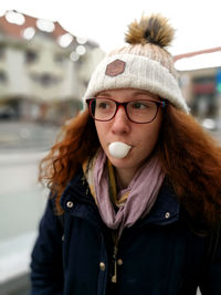 Portrait of young woman with ice cream