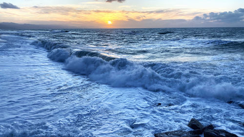 Scenic view of sea against sky during sunset