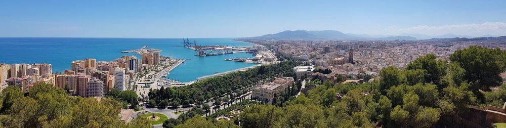 Panoramic view of townscape by sea against sky