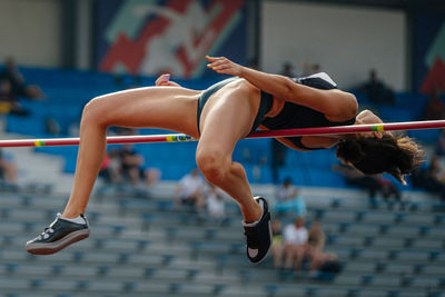 Low section of woman exercising in gym