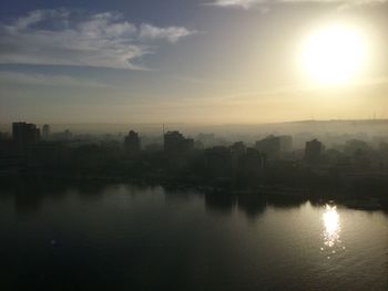 Scenic view of river at sunset
