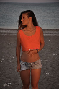 Young woman standing on beach