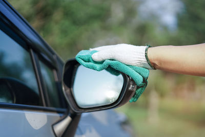 Low section of man holding car