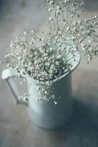 Close-up of white flower vase on table