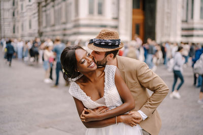 Young couple on street in city