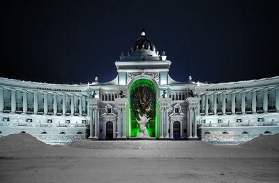 Historic building at night during winter