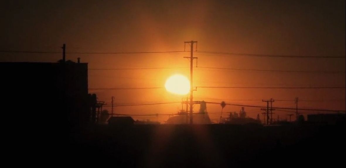 sunset, silhouette, sun, orange color, sky, power line, electricity, electricity pylon, built structure, building exterior, architecture, fuel and power generation, power supply, low angle view, sunlight, nature, connection, cable, beauty in nature, scenics