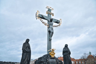 Low angle view of statue against sky