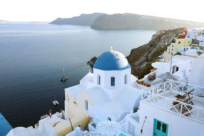 High angle view of white building by sea against sky