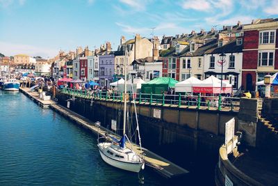 Boats moored at harbor