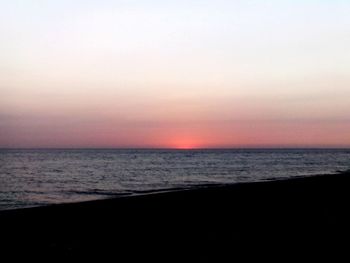 Scenic view of sea against sky during sunrise