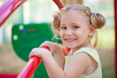 Portrait of cute smiling girl at playground