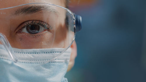 Close-up of female scientist wearing mask