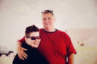 Portrait of smiling lesbian couple standing