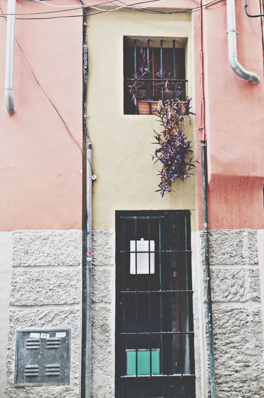 building exterior, architecture, built structure, window, residential building, residential structure, building, house, low angle view, door, balcony, closed, wall - building feature, day, brick wall, wall, outdoors, facade, no people, city