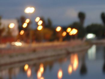 Defocused image of illuminated street lights at night