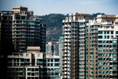 Modern buildings against sky in city