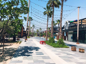 Street amidst buildings in city against sky