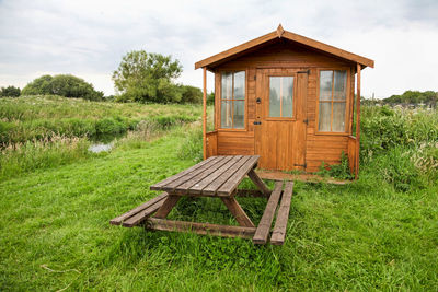 A shed and picnic table in the countryside