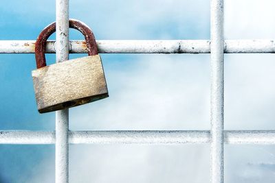 Close-up of padlocks on railing