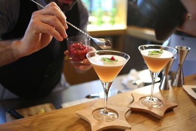 Midsection of man having drink