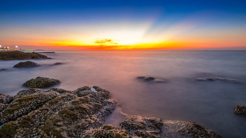 Scenic view of sea against sky during sunset