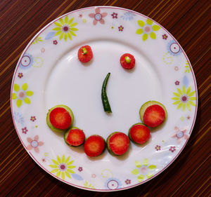 High angle view of fruits in plate on table