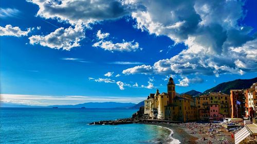 View of sea and buildings against sky