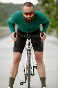 Low section of man riding bicycle