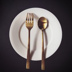 High angle view of wineglass on table against black background