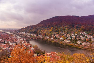 Aerial view of townscape against sky during autumn