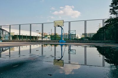 View of basketball court against cloudy sky